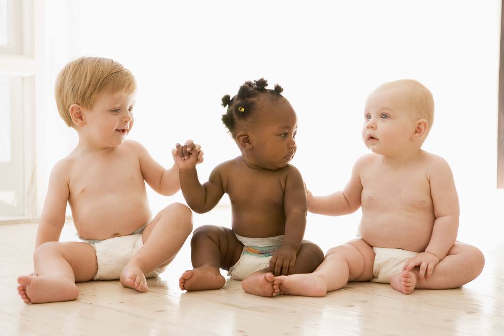 babies sitting together on the floor