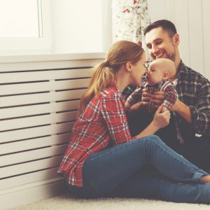 A couple with a baby in their arms