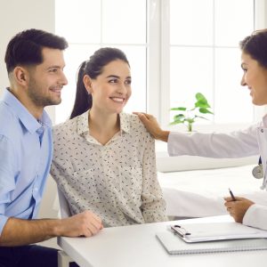 couple being reassured by doctor