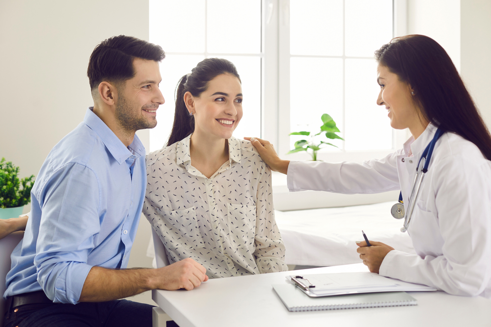 couple being reassured by doctor