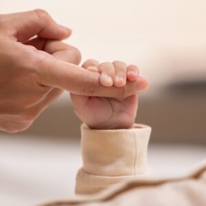 Baby holding a finger