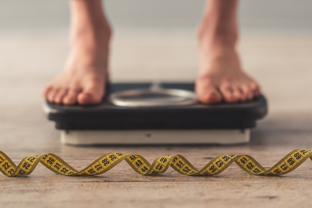 feet on weight scales